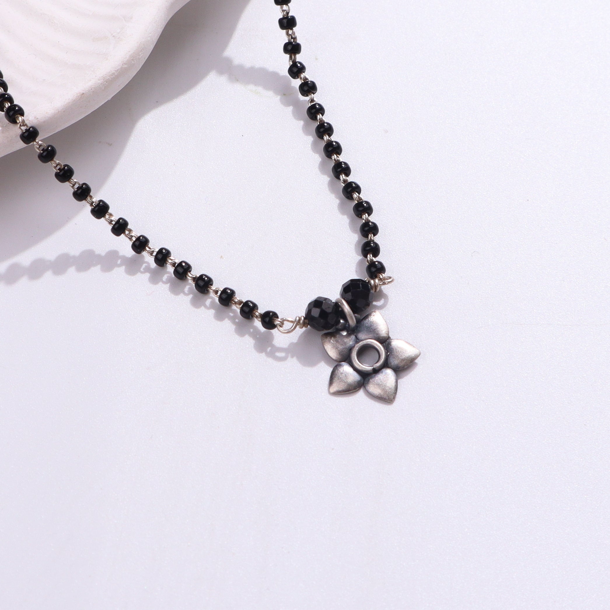 Black beaded necklace with silver accents
