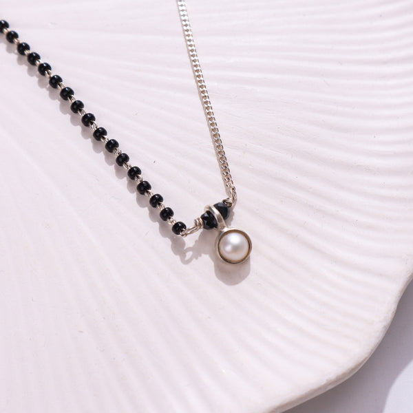 Silver and black beaded necklace with pearl pendant