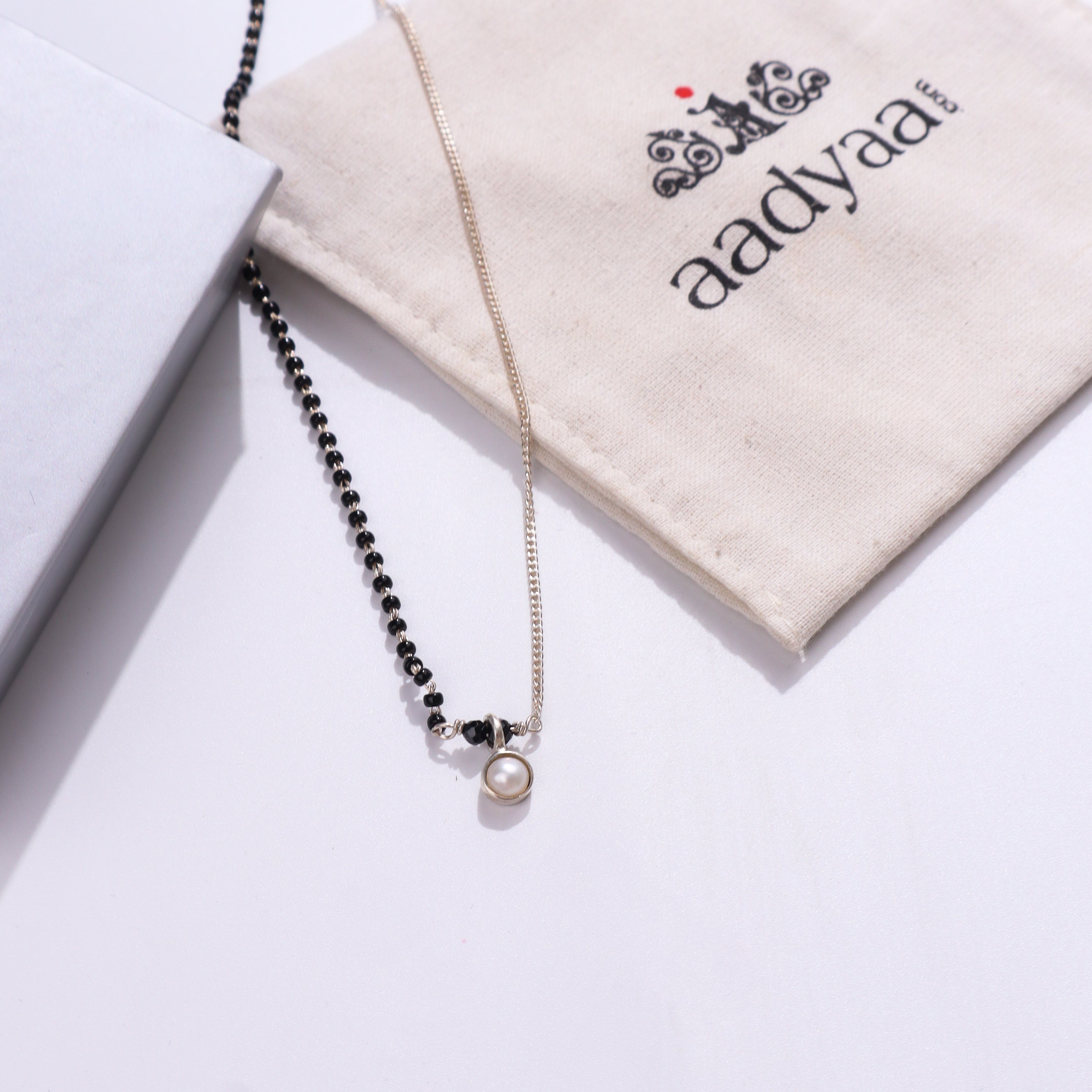 Silver pearl necklace with black beads
