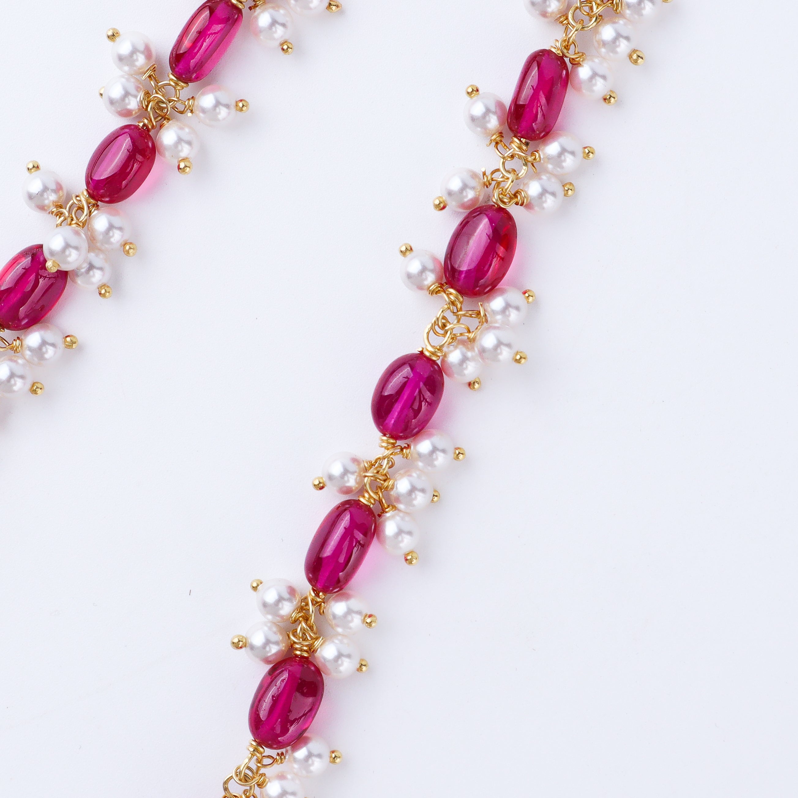 Handcrafted luxe necklace with ruby and pearls polished finish