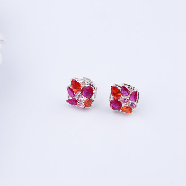 Colorful gemstone stud earrings on white background