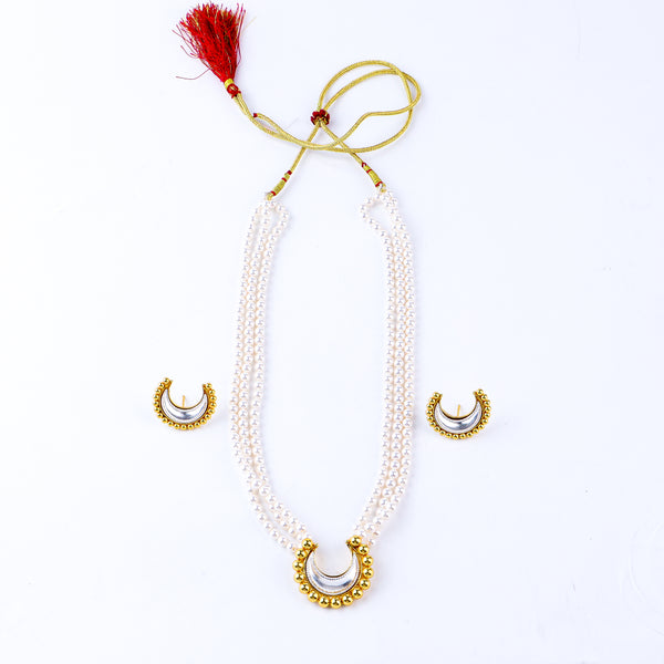 Gold and silver crescent jewelry set with pearl strands