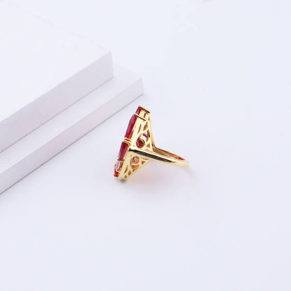 Gold ring with red gemstones