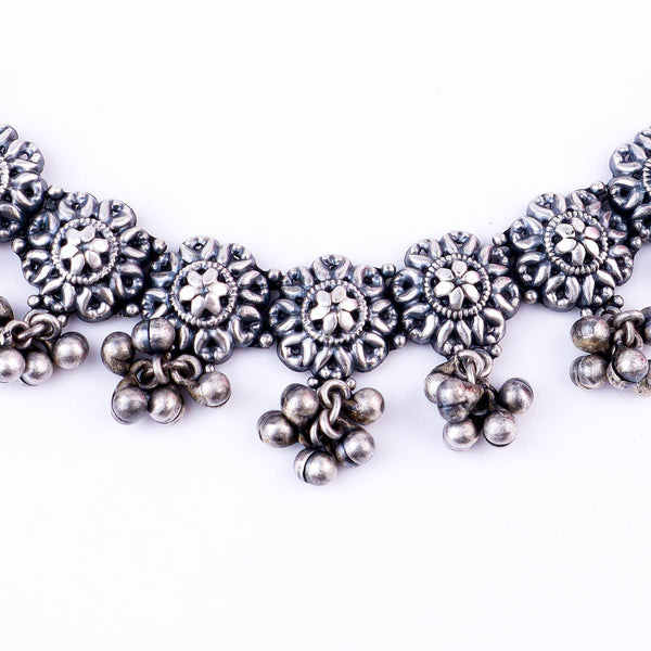Silver floral jewelry set with intricate design