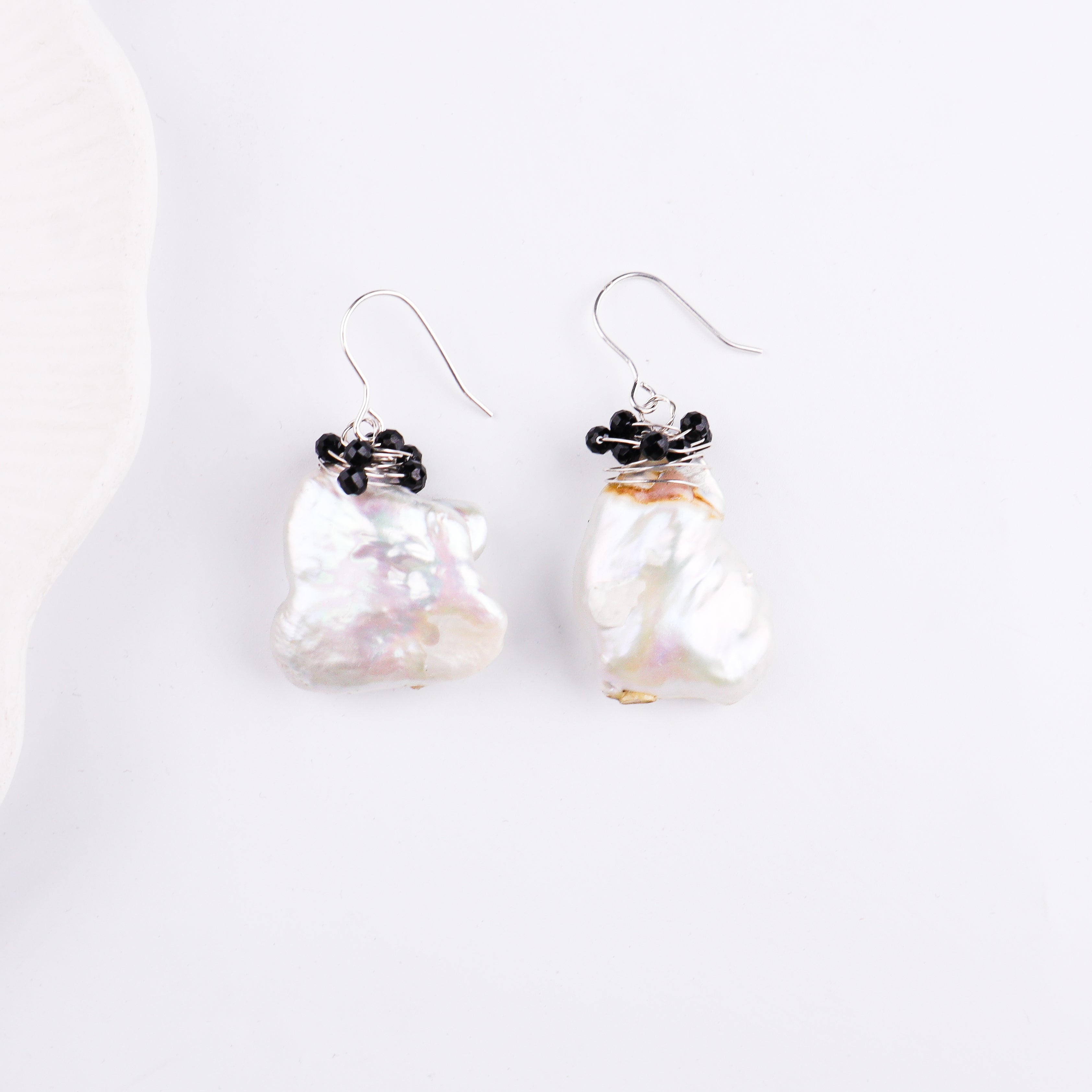 Silver hook earrings with black beads and pearl detail