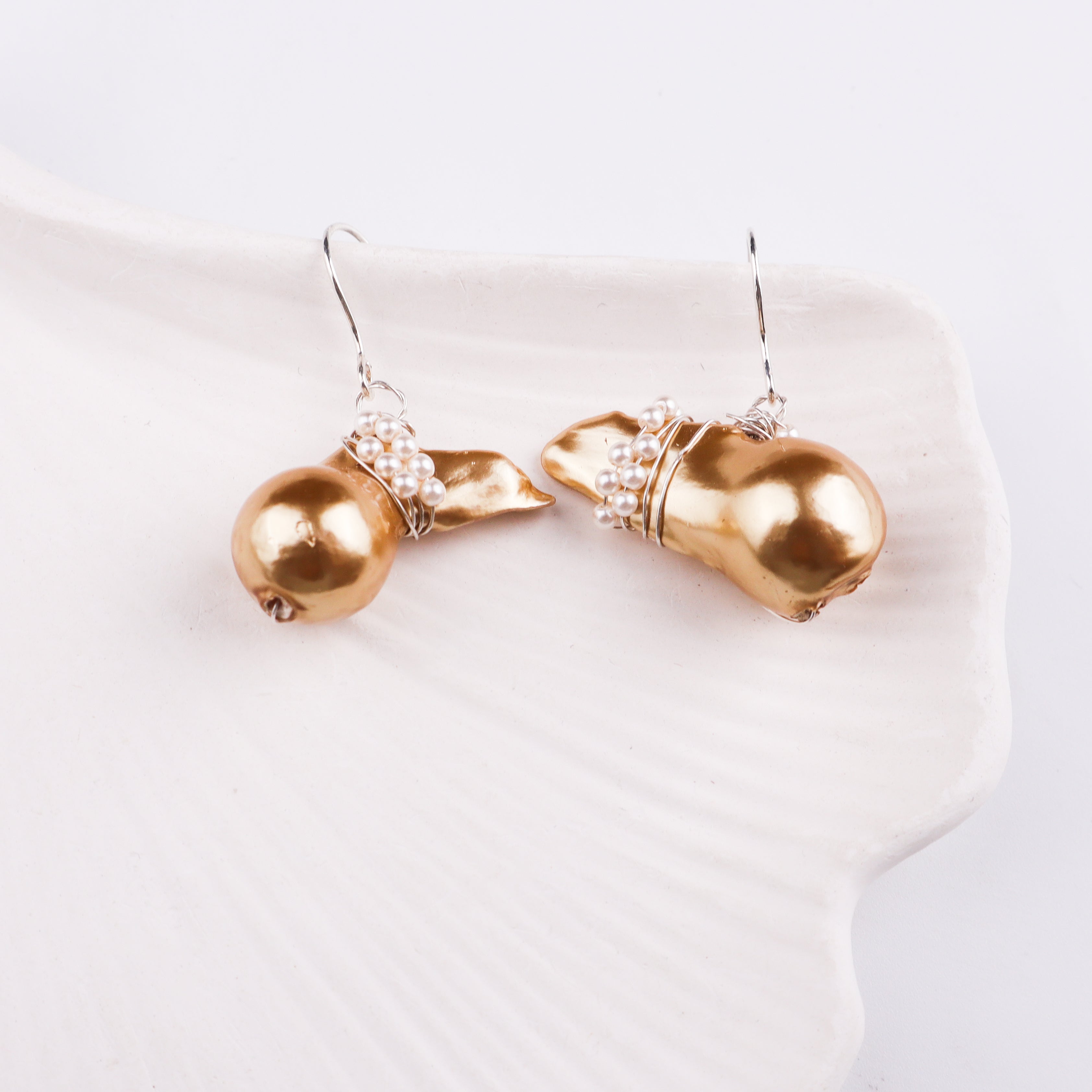 Silver hook earring with pearl and gold accents