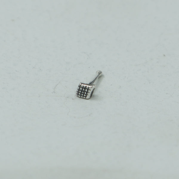 Silver dotted diamond nose pin with textured design