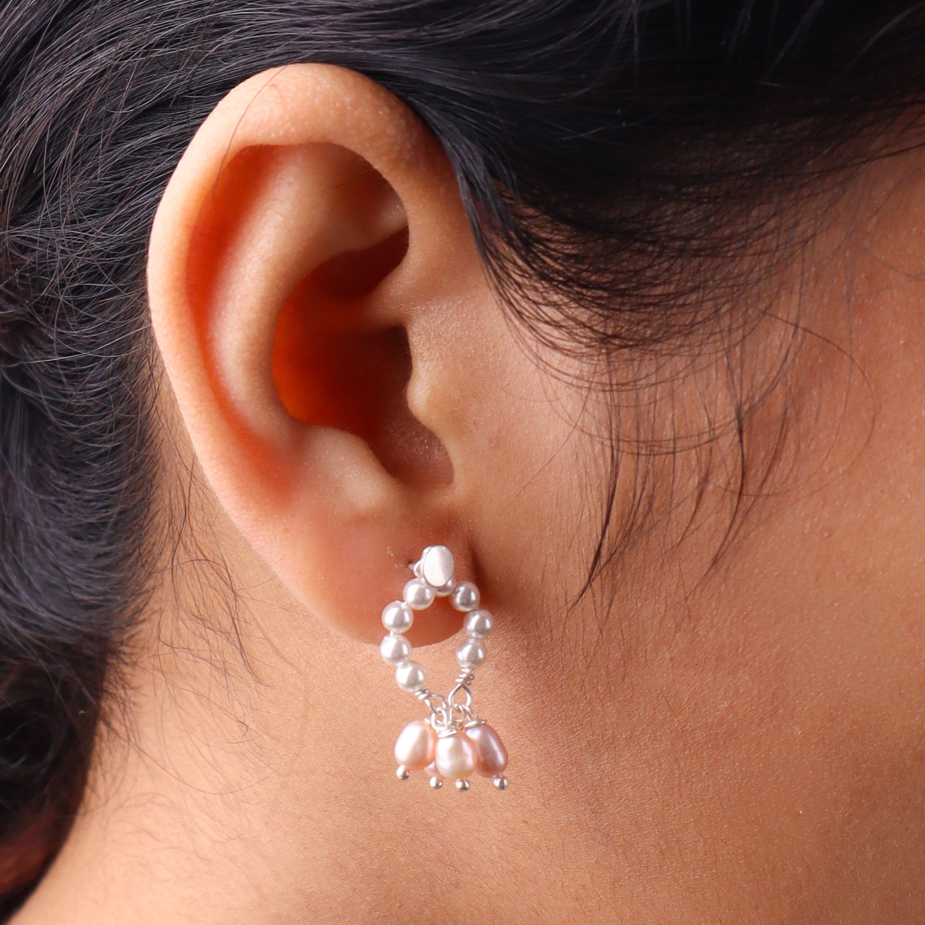 Close-up of earrings on white background