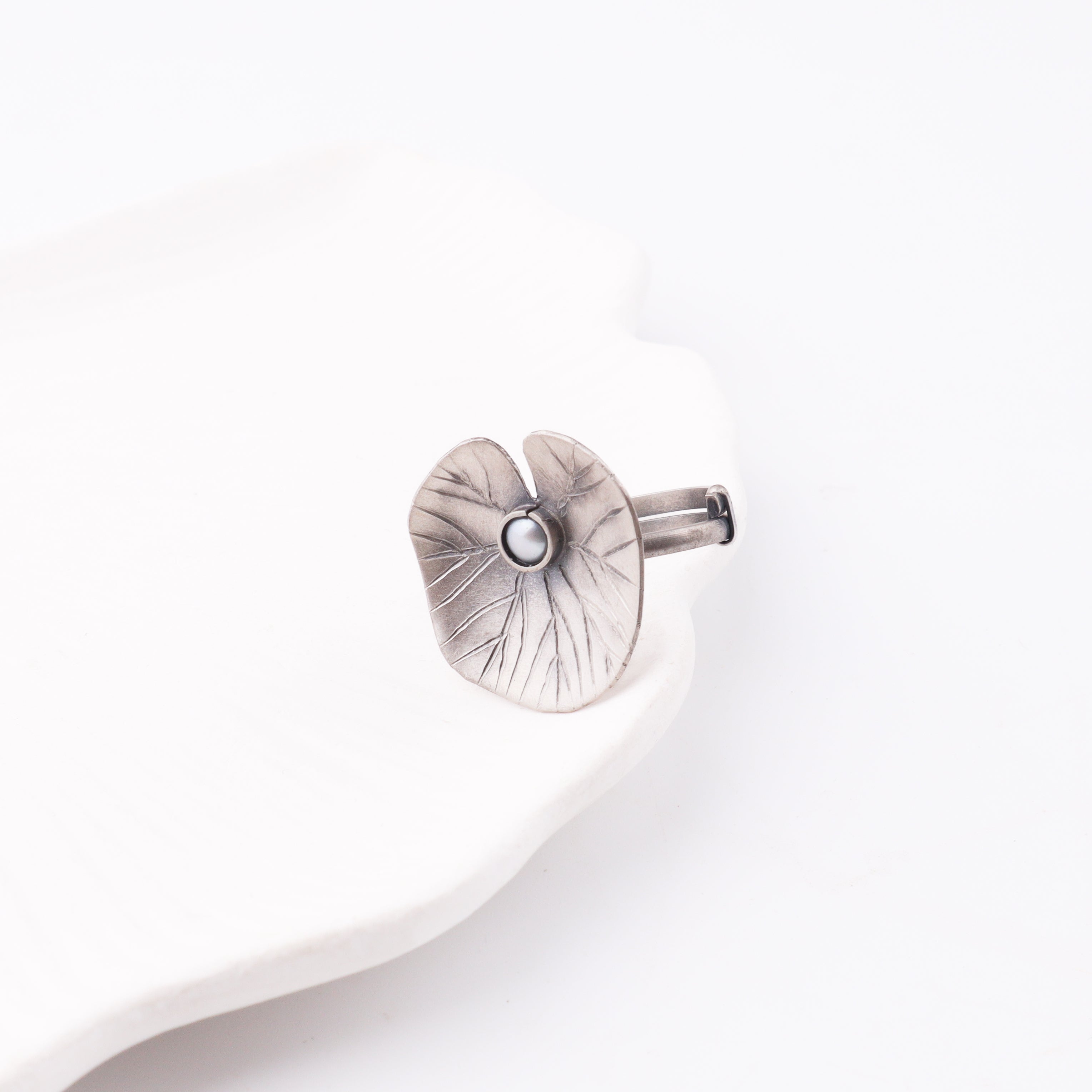 Silver flower-shaped jewelry clasp
