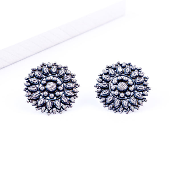 Angled side view of Oxidized Nakshi Earrings in silver