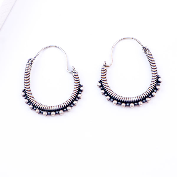 Flat-lay oxidized spring hoop earrings 
