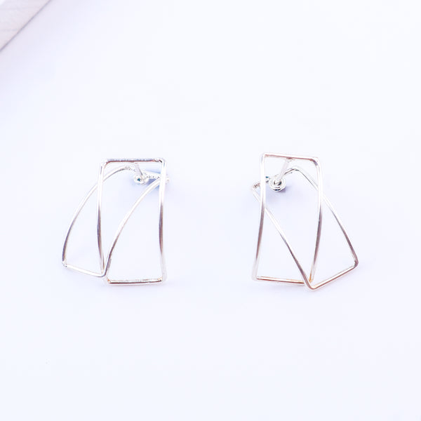 Frame arc hoops styled with modern outfit