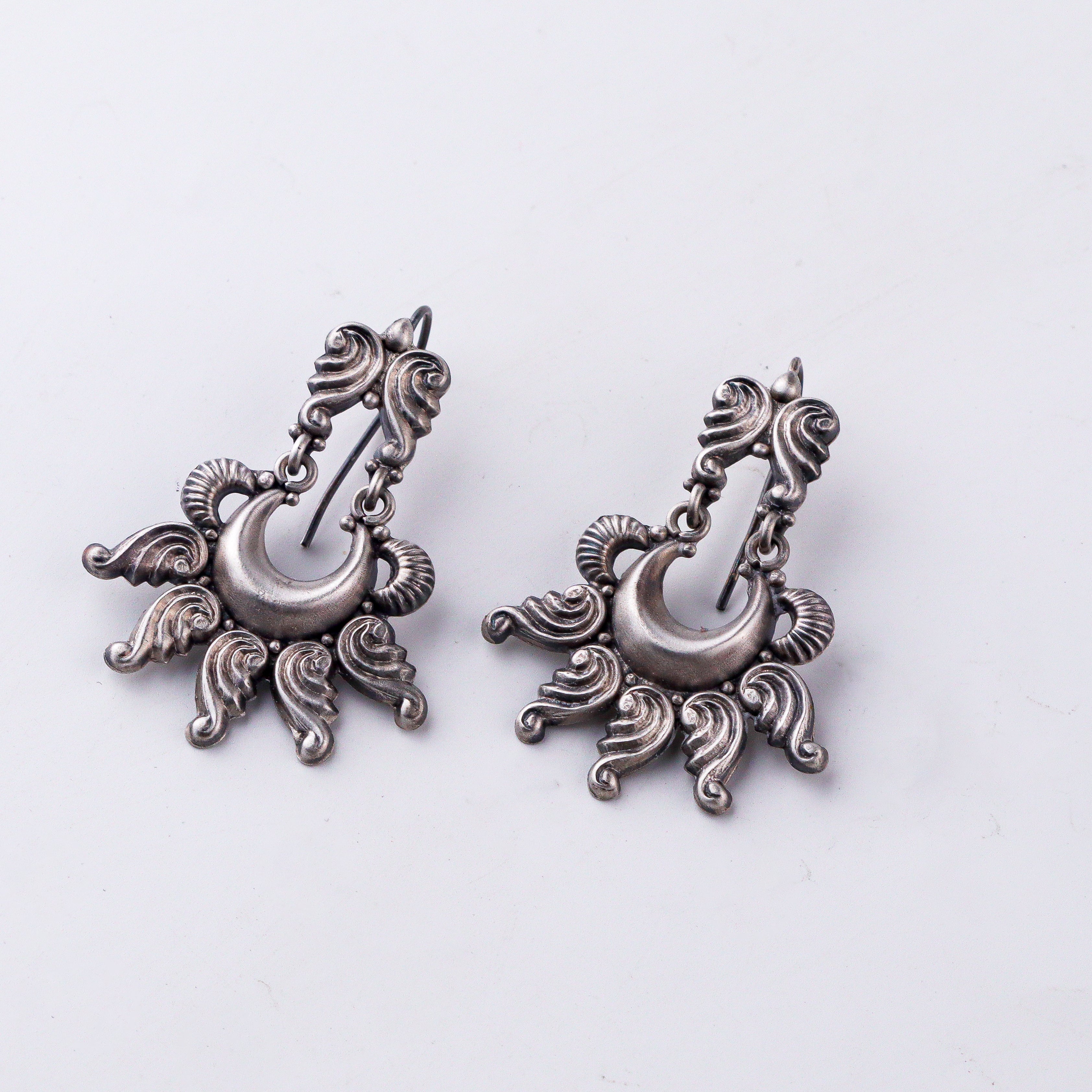 style silver shankha earrings with ethnic outfit