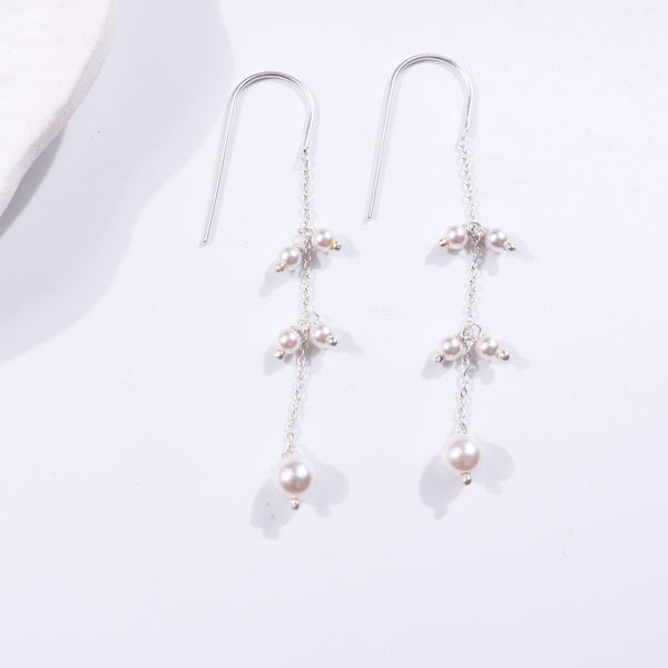 Pearl dangler earrings with silver chain design