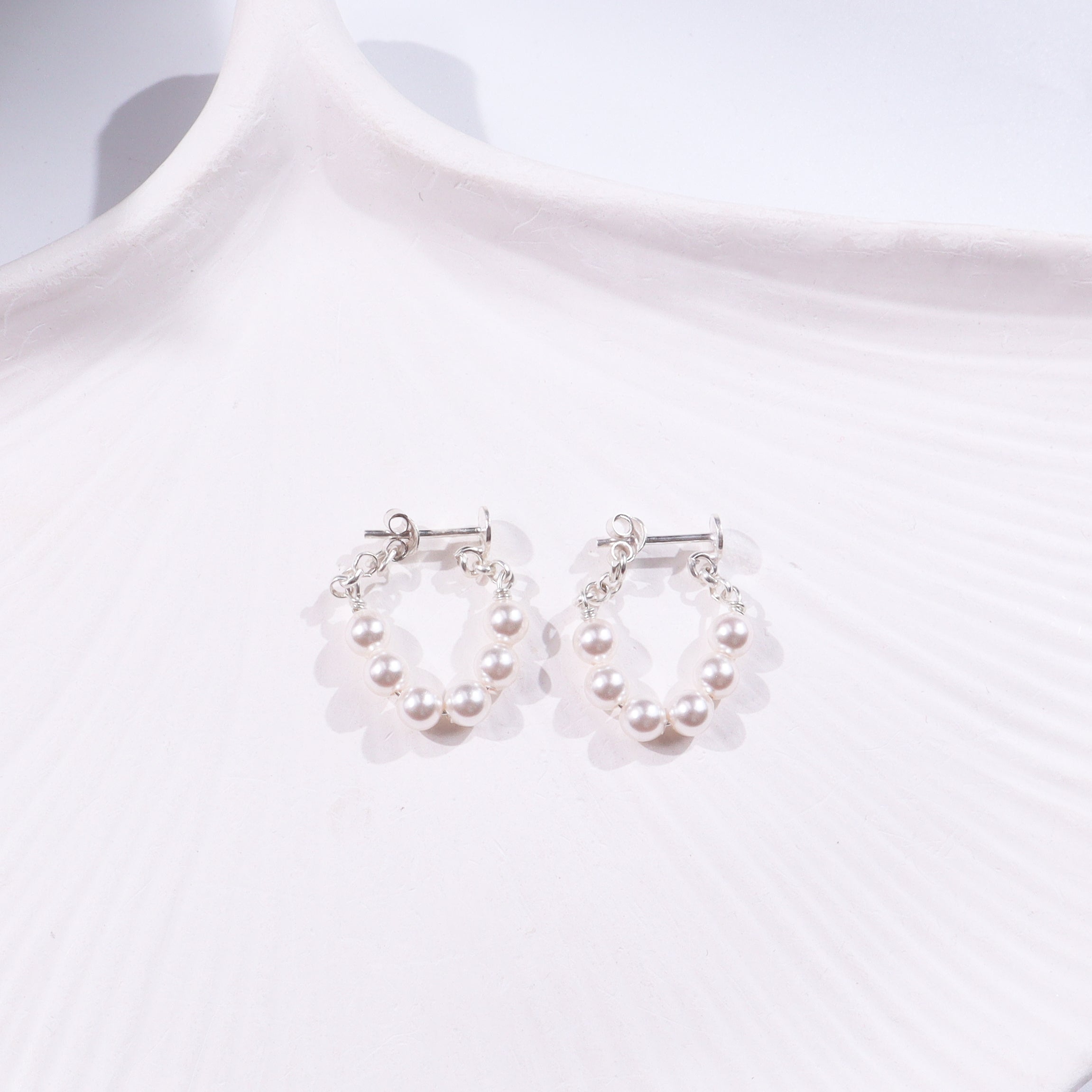 Elegant pearl earrings with silver hooks