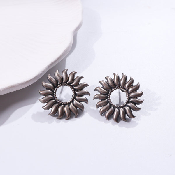 Sterling silver sun-inspired earrings with intricate design