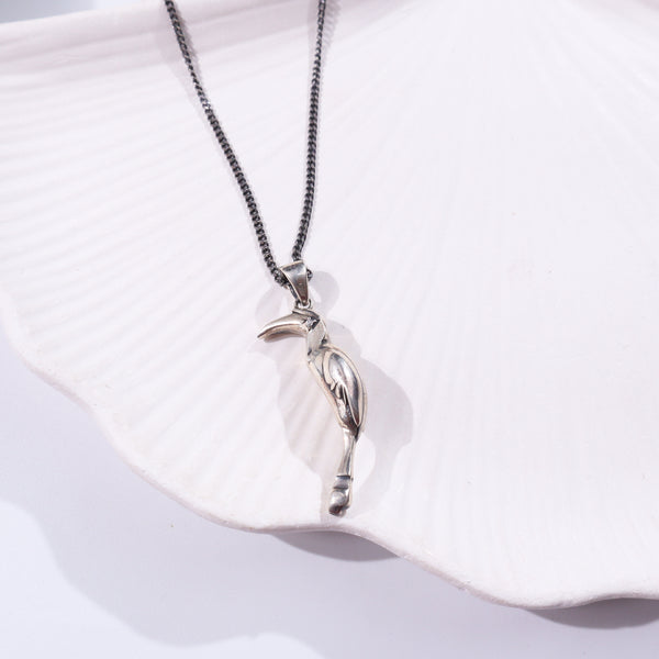 Silver pendant with crescent moon design