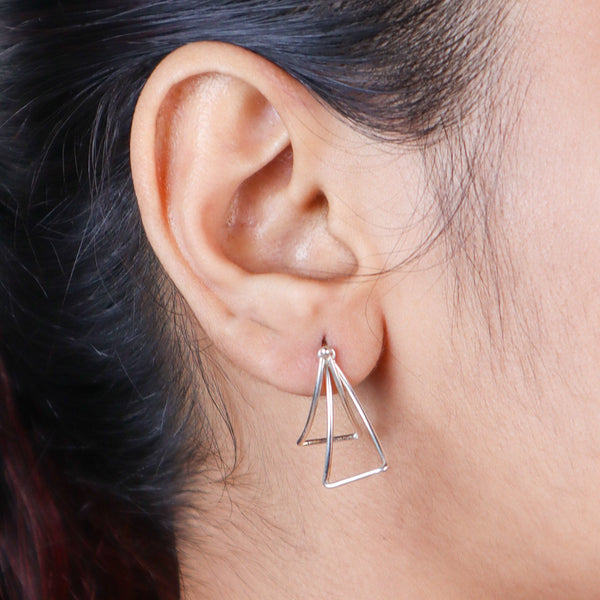 Close-up of sterling silver triangle earrings