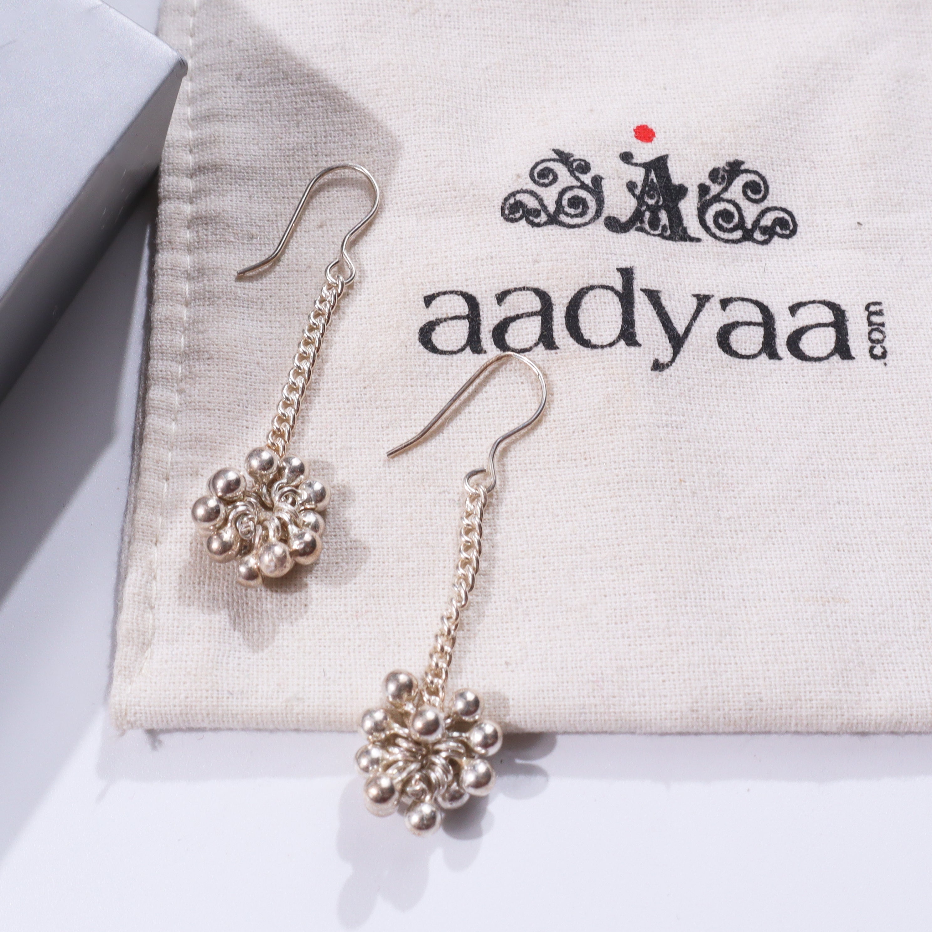 Silver earrings with ghungroo beads for traditional jewelry
