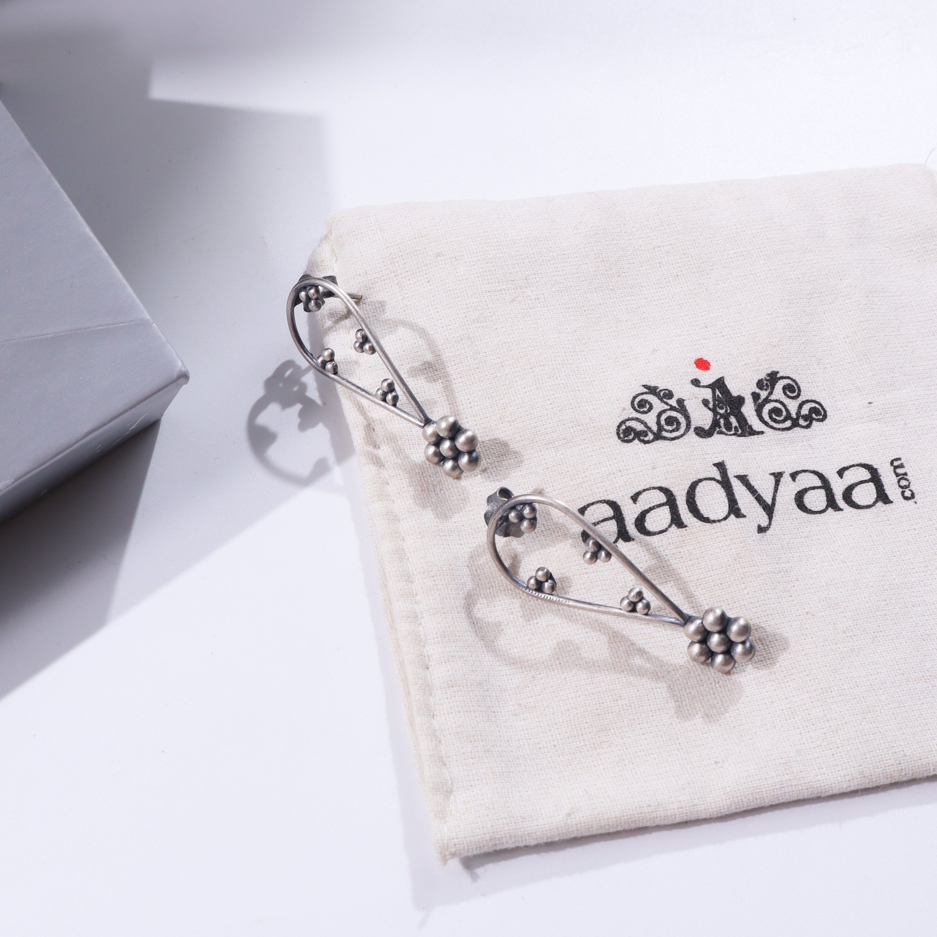 Kudi Silver Earring on fabric