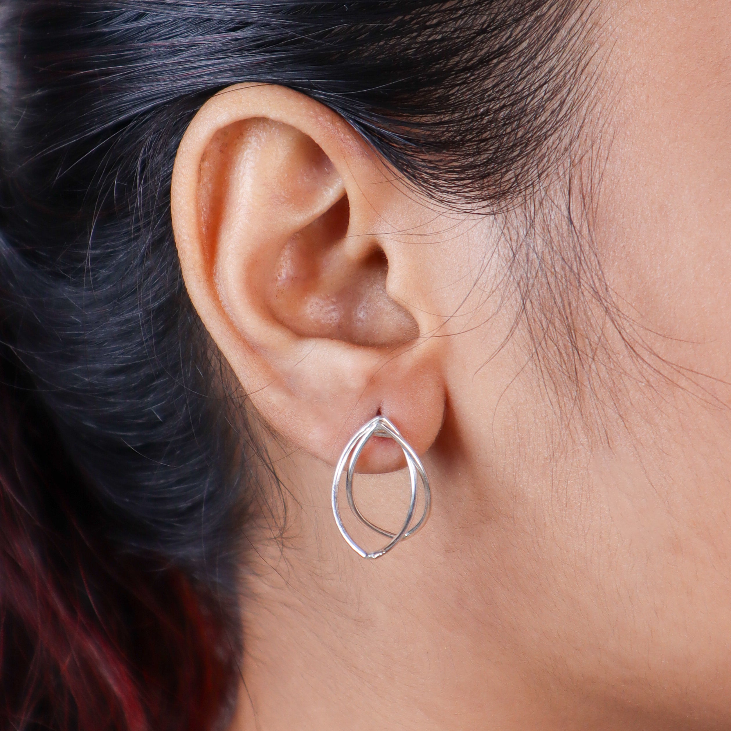 petal detailing on arc hoop earrings