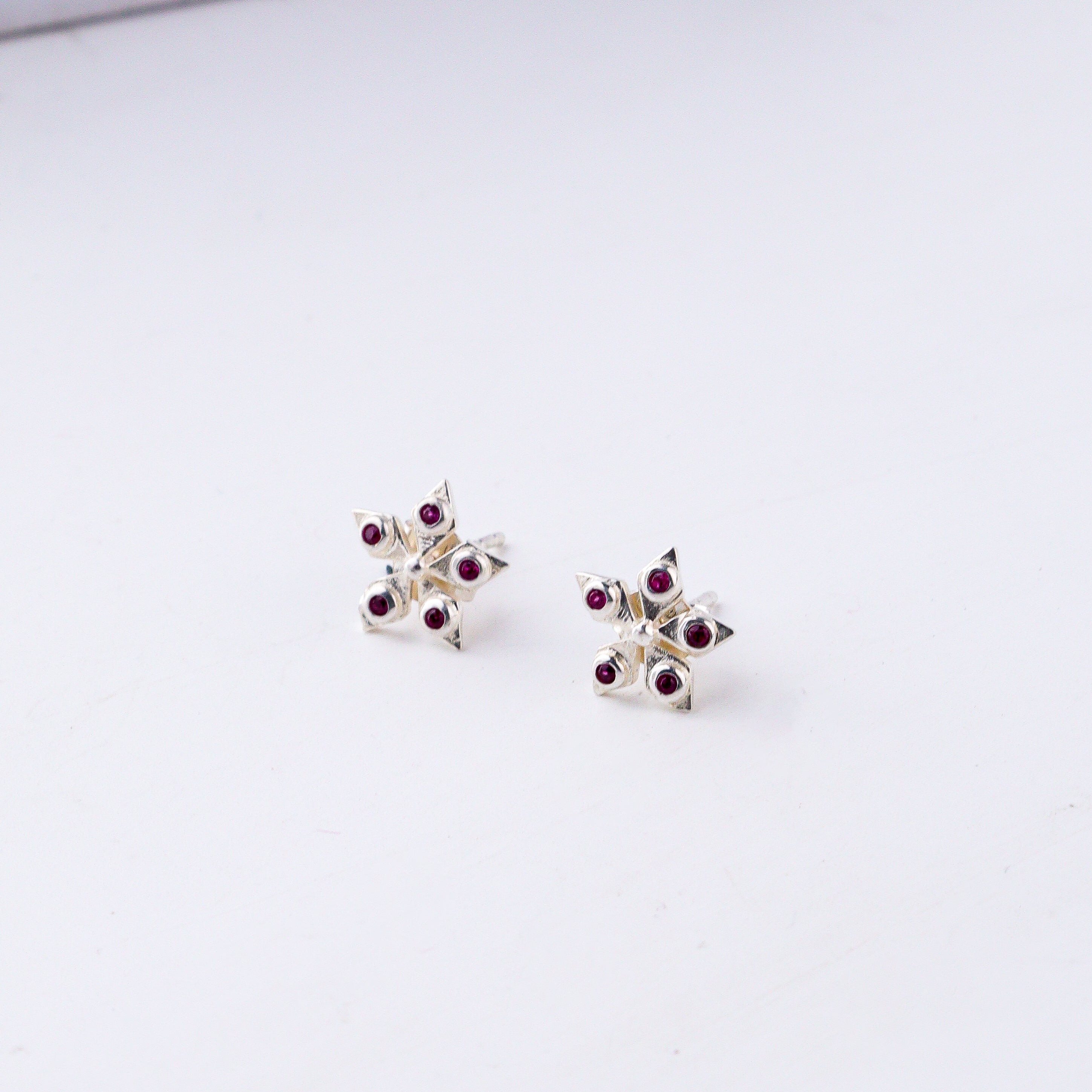 Handcrafted silver Nakshatra studs polished finish