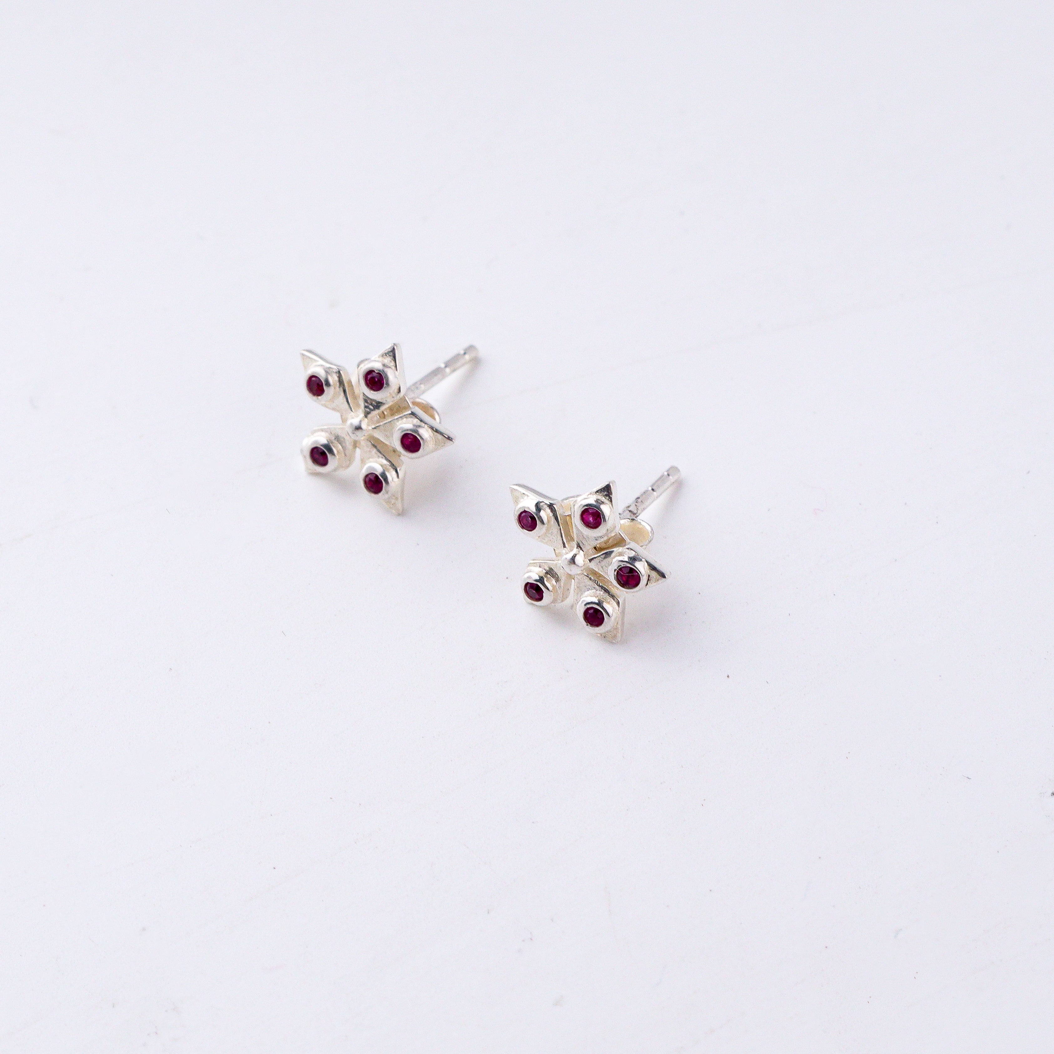 Silver Nakshatra studs in 92.5 sterling silver with ruby stones