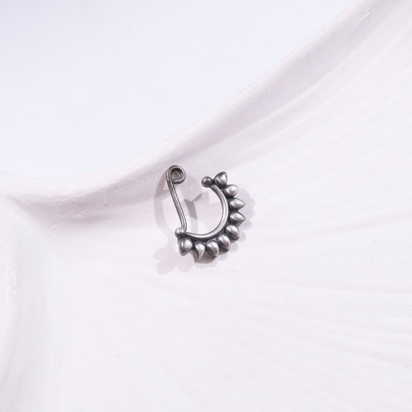Silver floral necklace on white background
