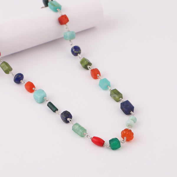Beaded gemstone necklace on white background
