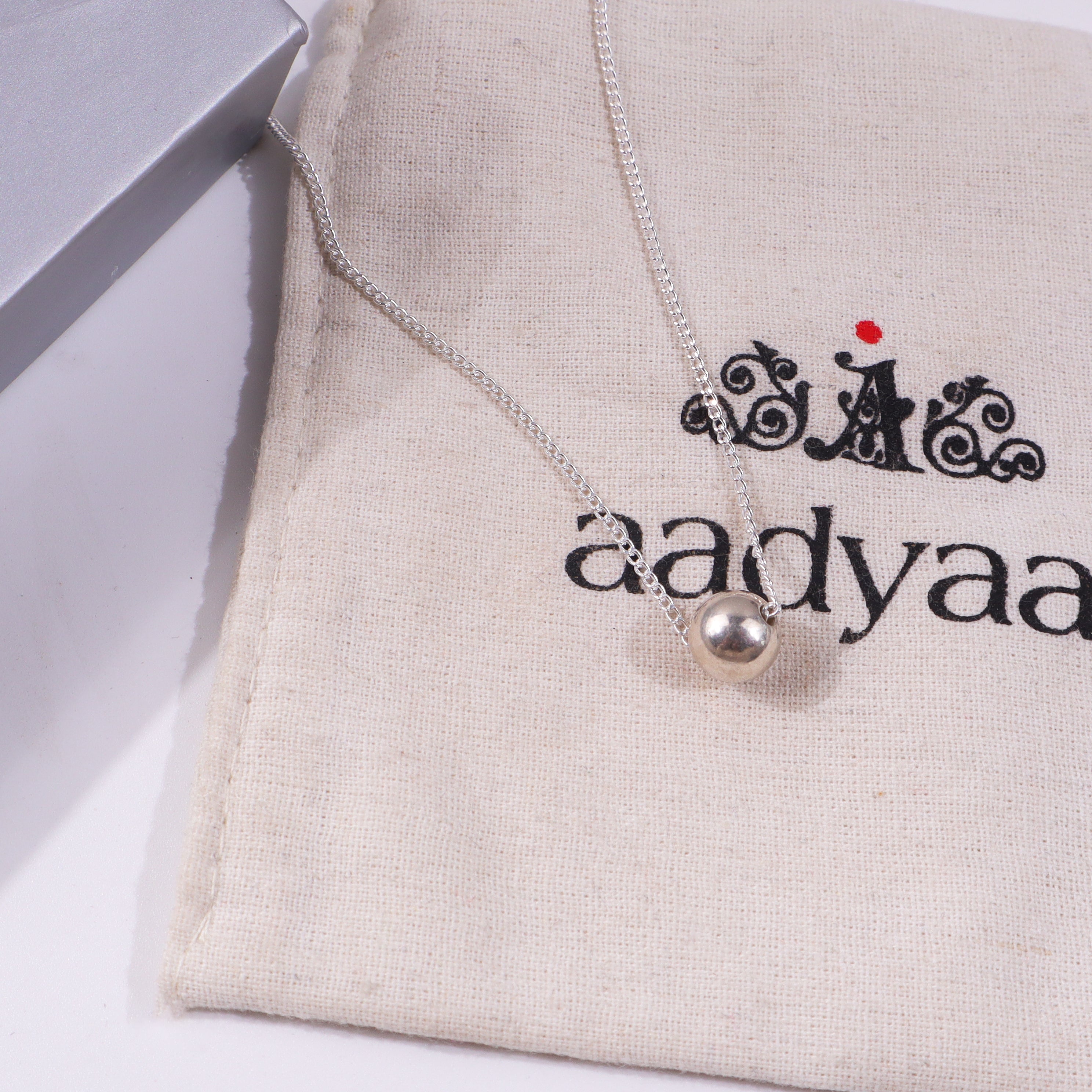 Silver Bead Chain Necklace on fabric