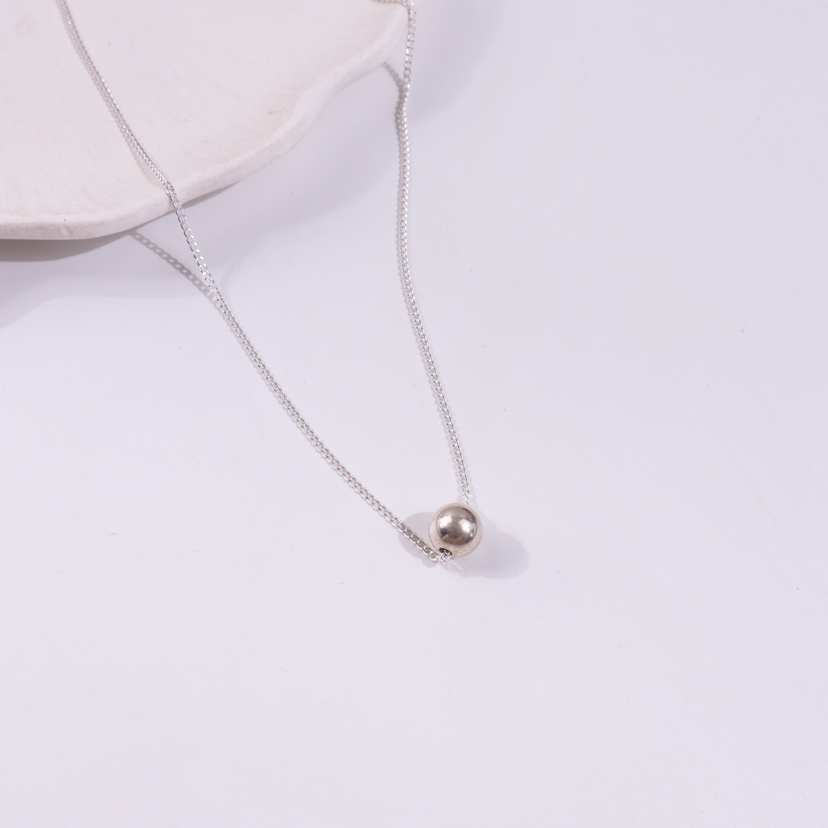 Silver beaded necklace with pendant