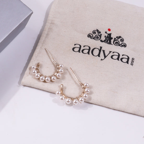 Pearl earrings with gold accents