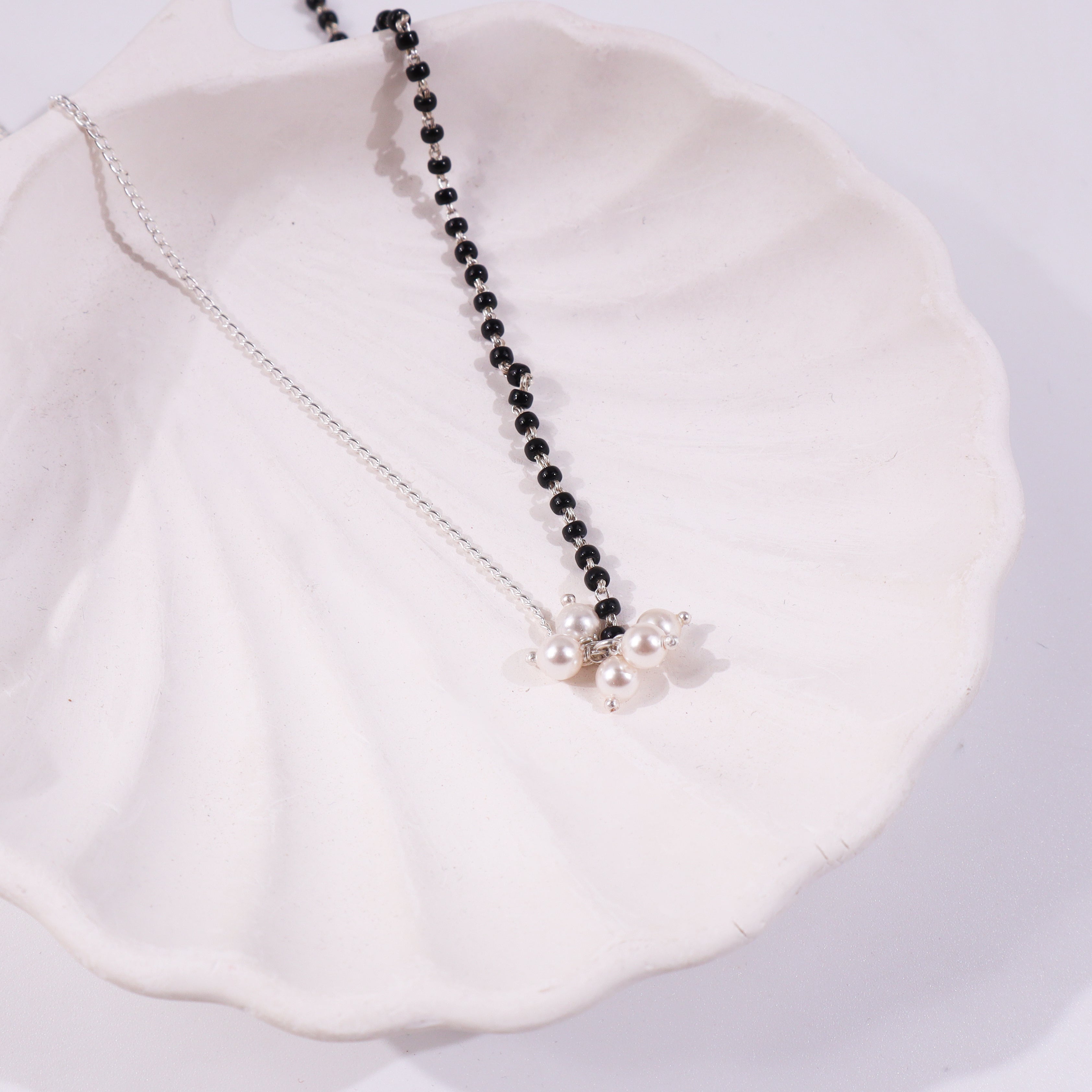 Black and silver beaded necklace with pearl pendant