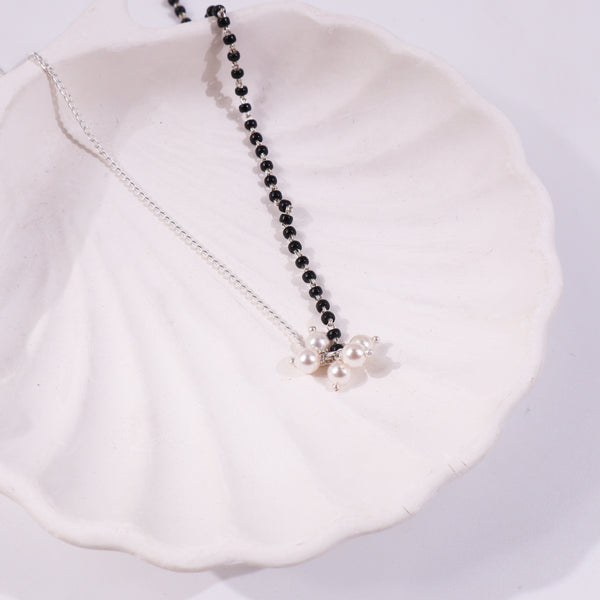 Black and silver beaded necklace with pearl pendant