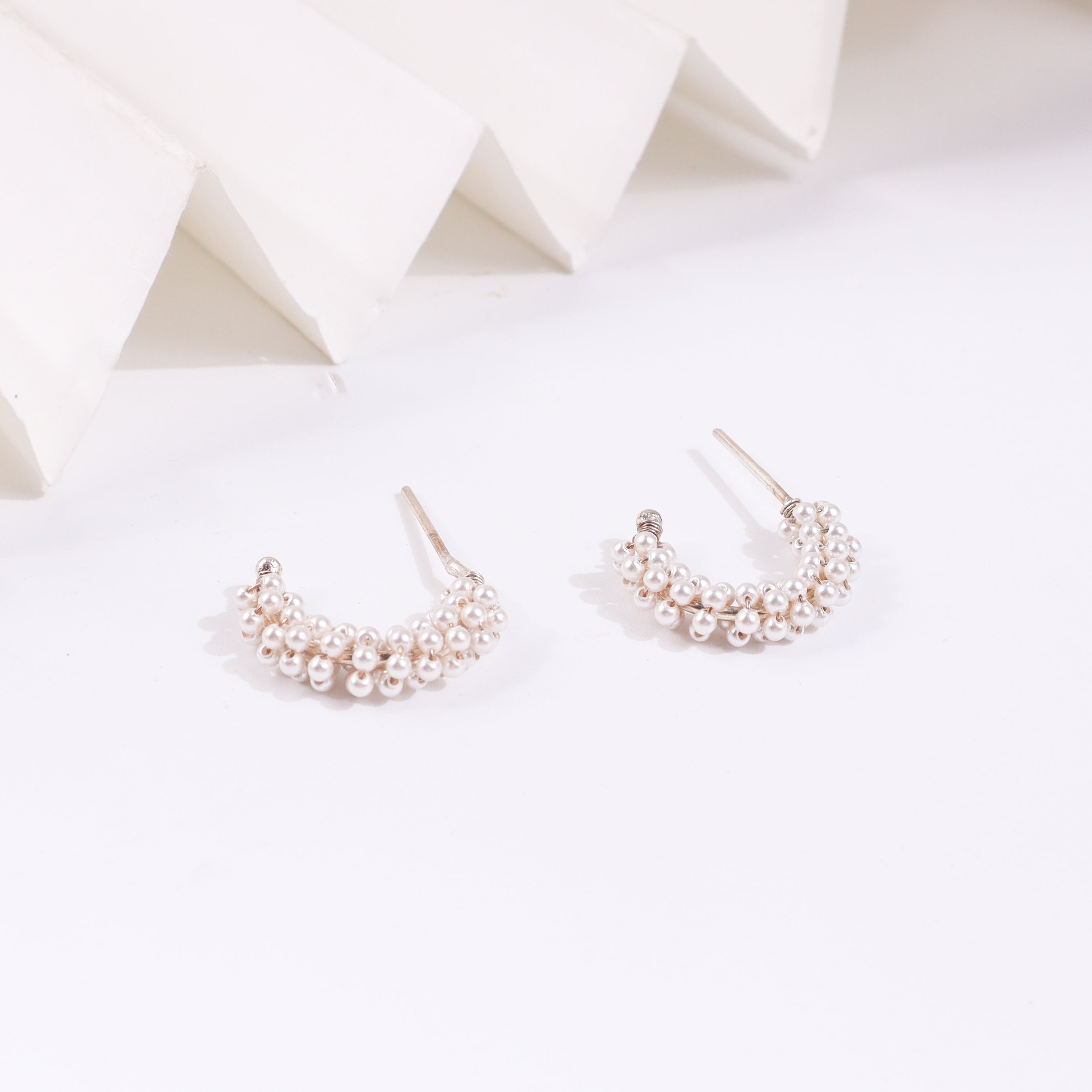 Pearl hoop earrings with gold accents