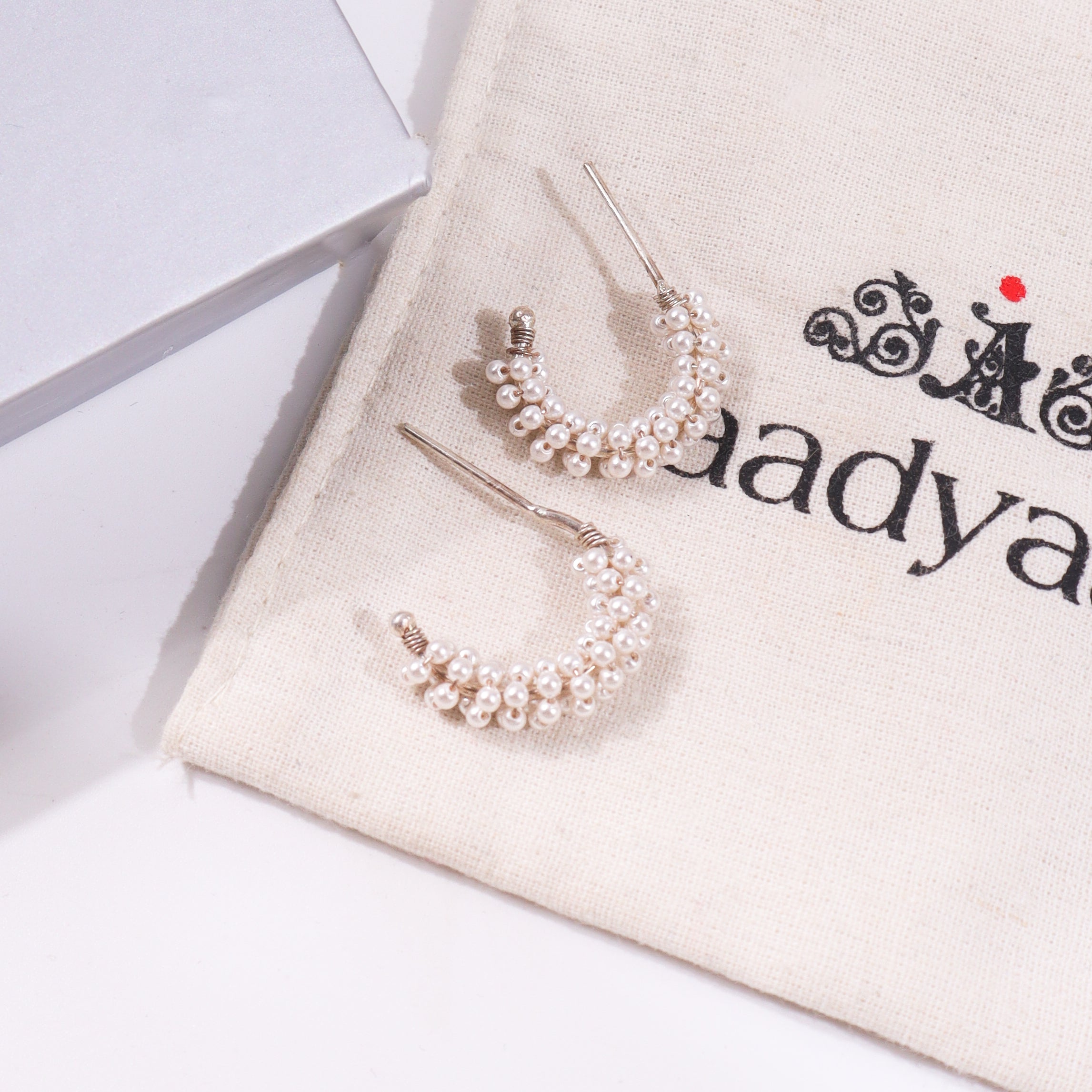 Pearl hoop earrings with silver accents