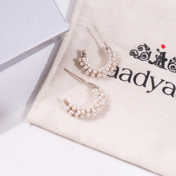 Pearl hoop earrings with silver accents