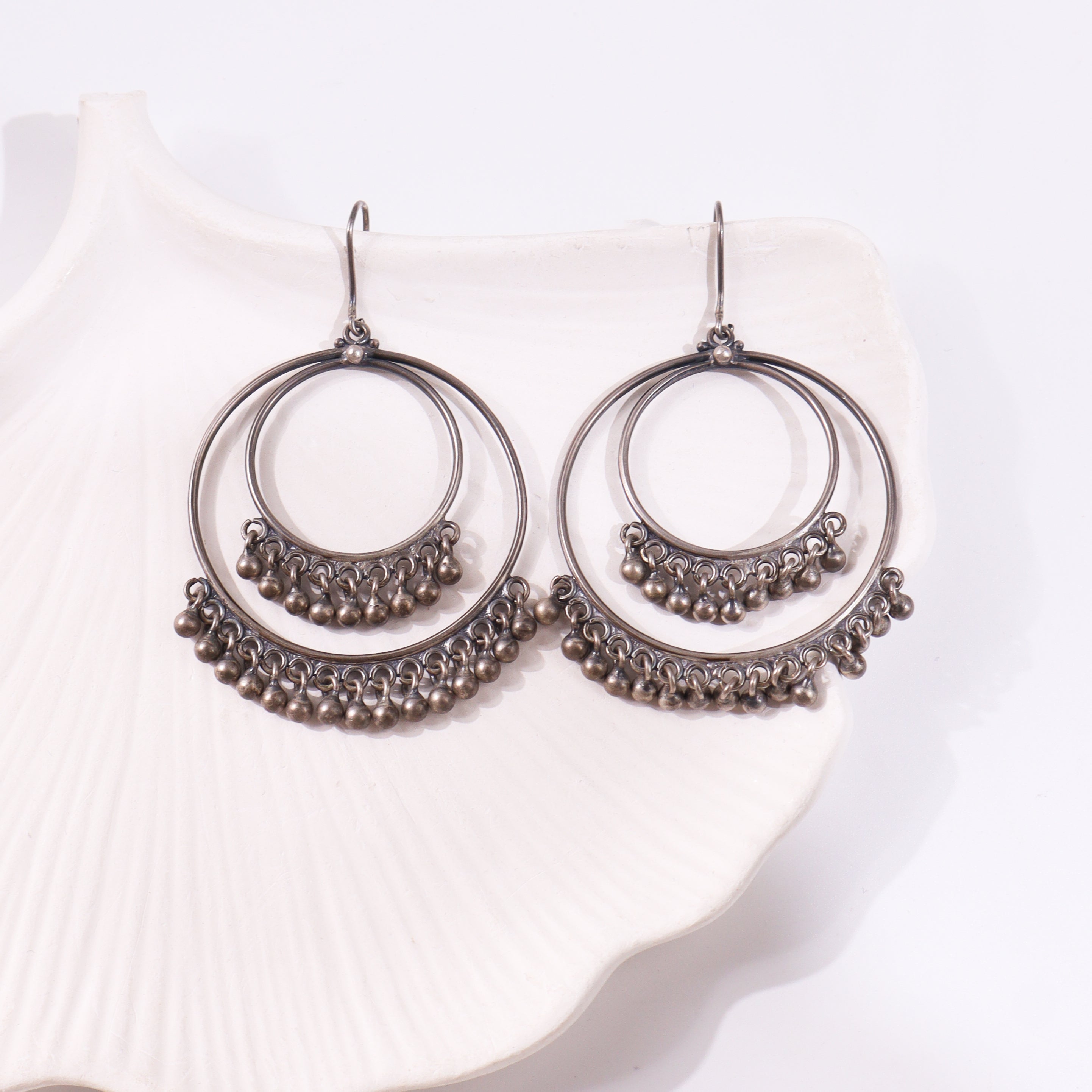 Sterling silver hoop earrings with dangling beads