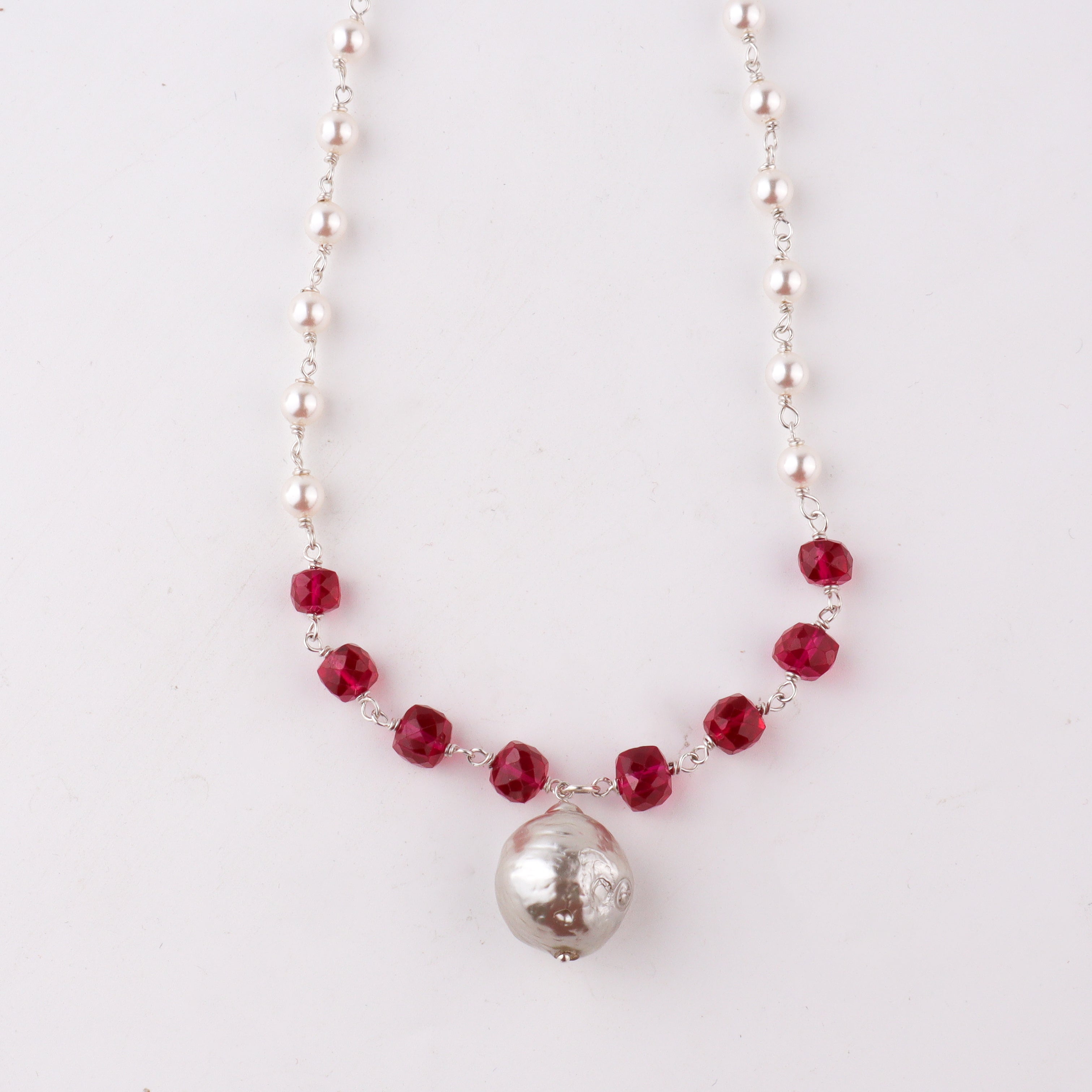 Handcrafted silver baroque pearl necklace with ruby polished finish