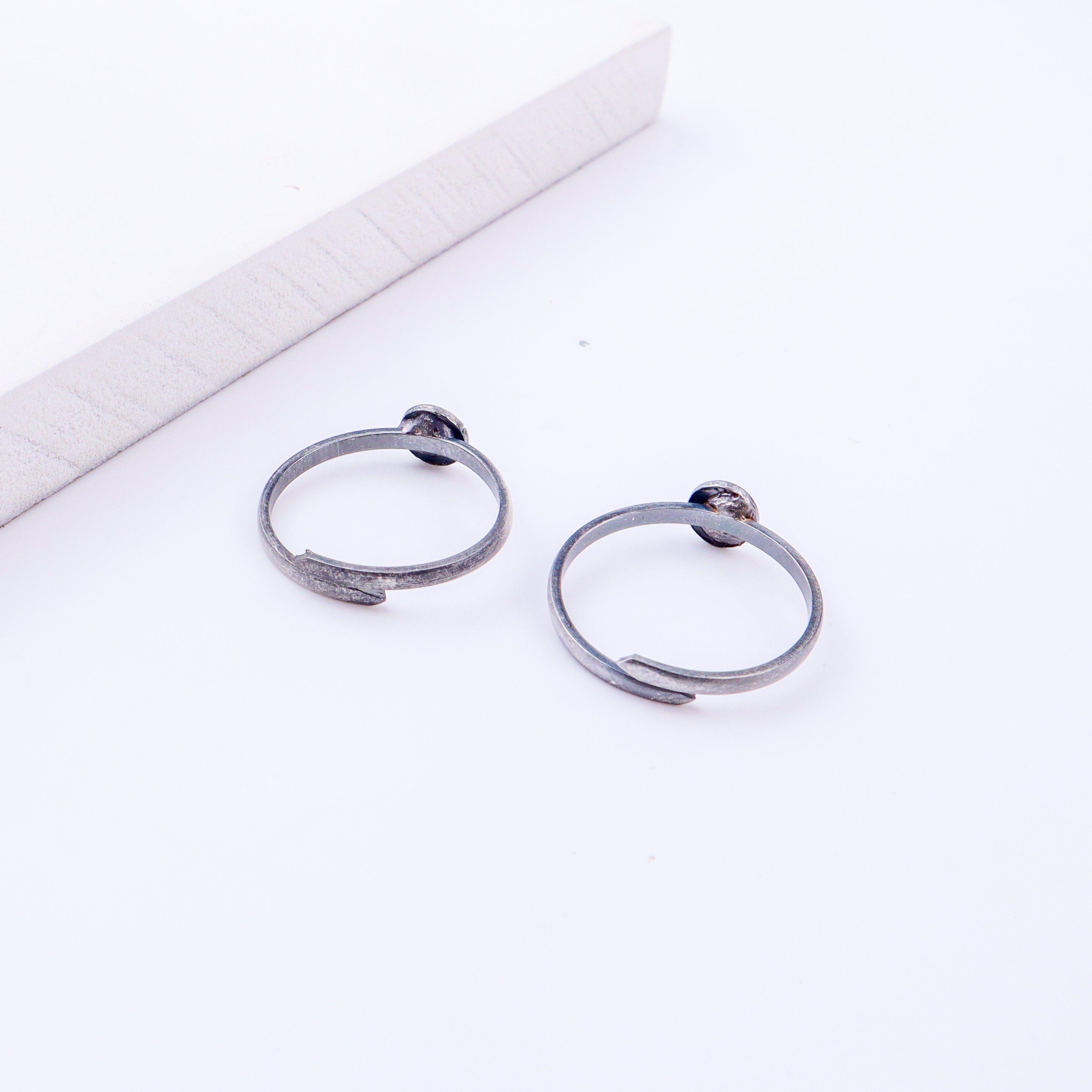 Detail shot highlighting textured finish and open adjustable band