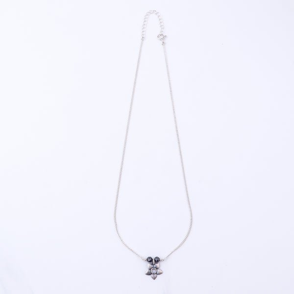 Silver necklace with black beads and owl pendant