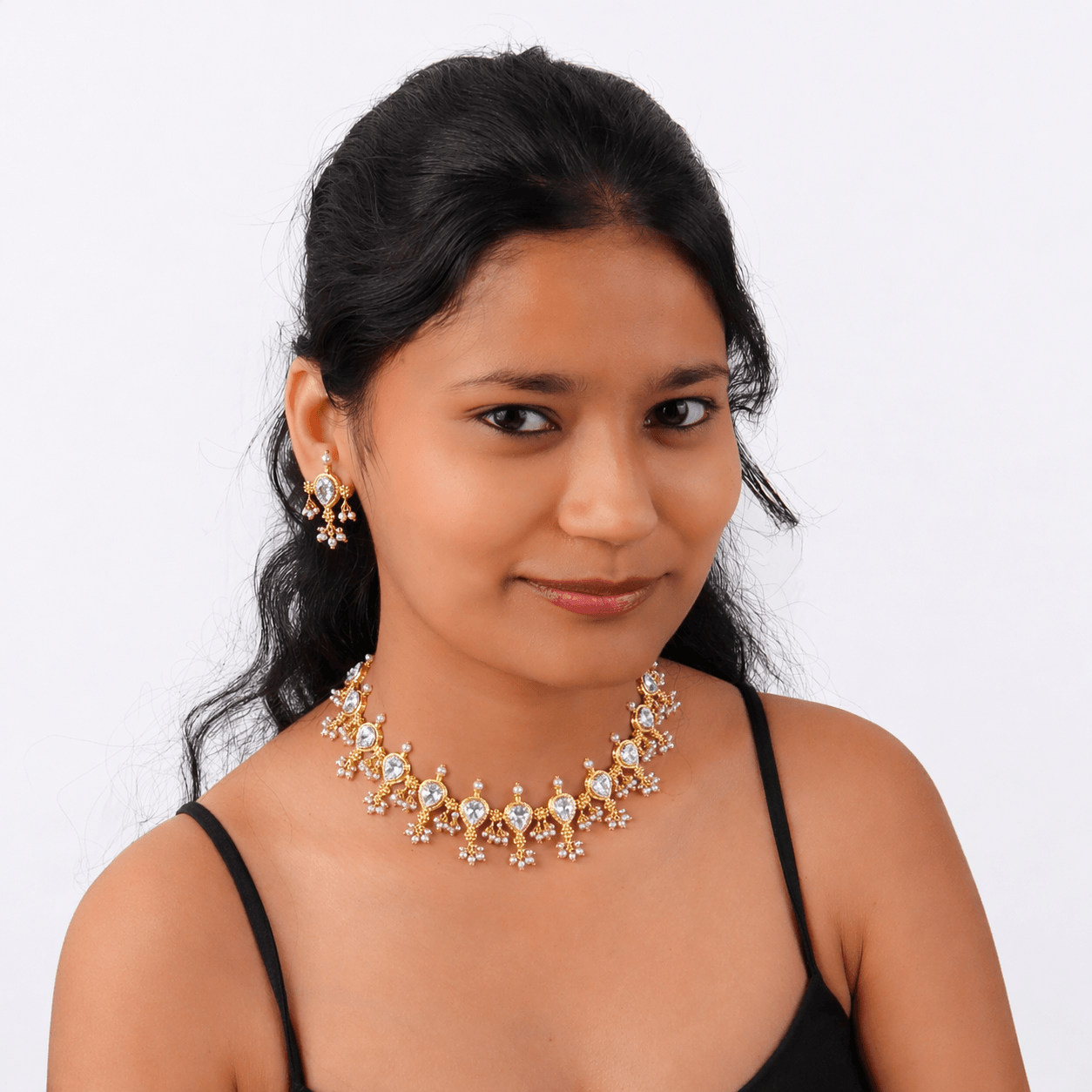 Elegant gold and diamond jewelry set with necklace and earrings