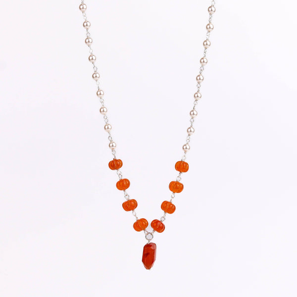 Model wearing pearl Ganthan necklace with semiprecious stones for festive or wedding styling