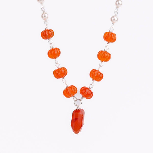 Woman styling 92.5 silver pearl Ganthan necklace with semiprecious stones alongside ethnic outfit