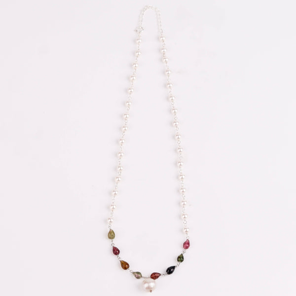 Woman styling 92.5 silver pearl Ganthan necklace with semiprecious stones alongside ethnic outfit