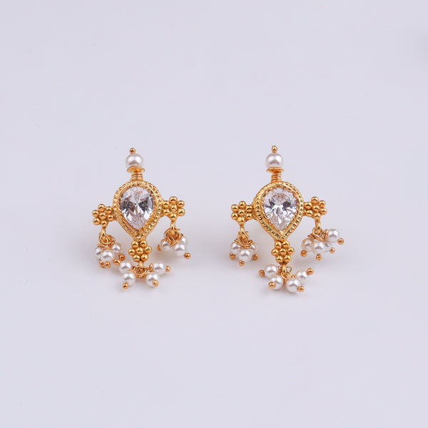 Gold and pearl earrings with intricate design