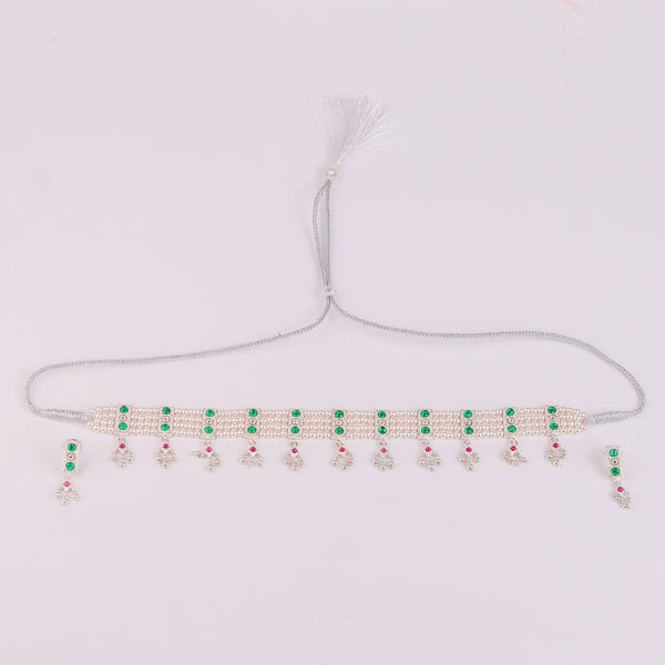 Flat lay of Silver Green Stone and Pearls Chinchapeti Set