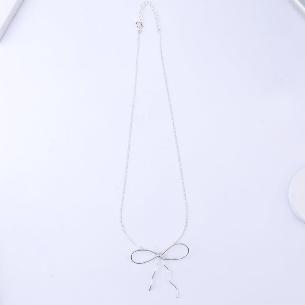 Silver bow necklace with chain and pendant
