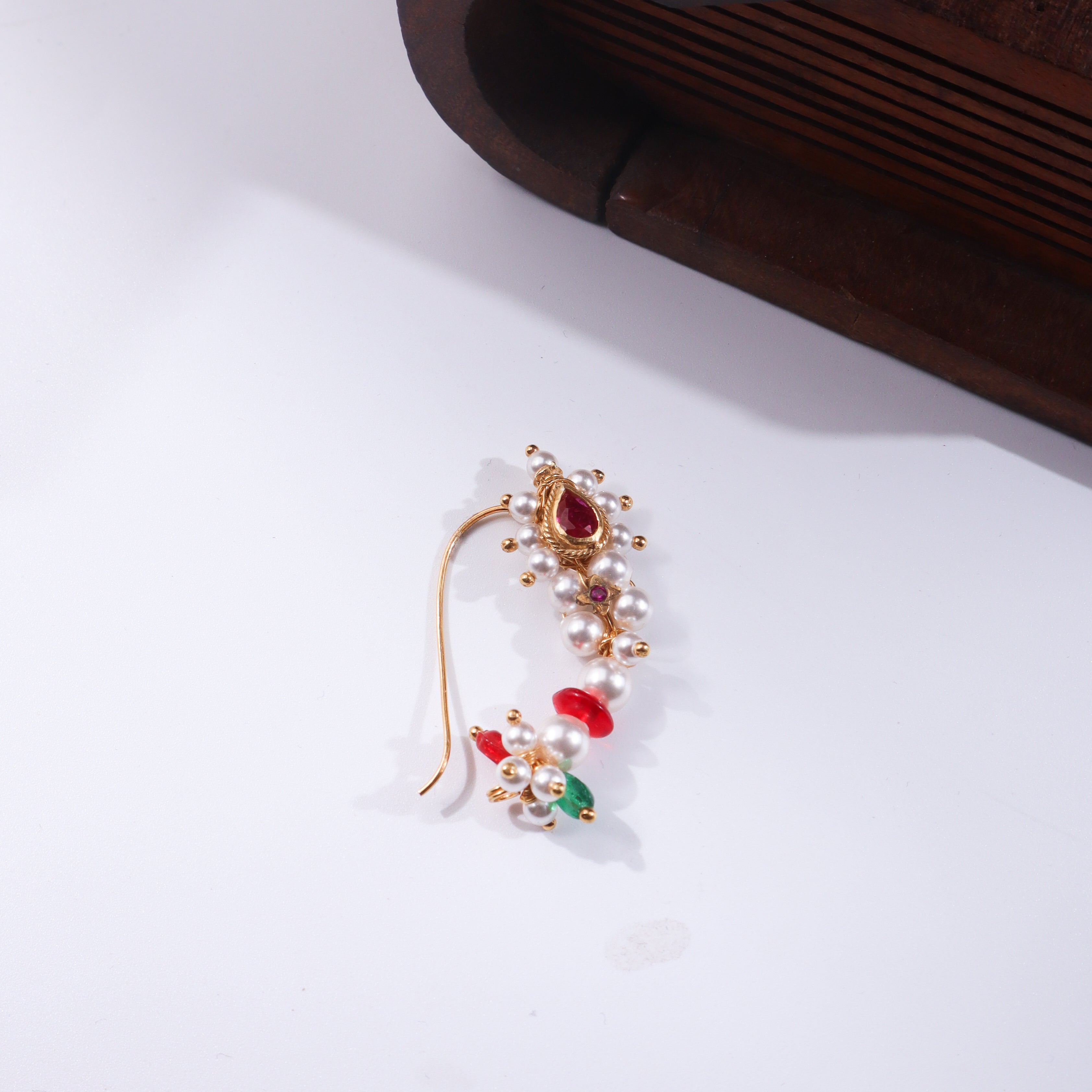 Wooden jewelry box with pearl and ruby nose ring