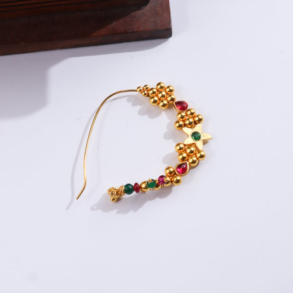 Gold and colored bead earrings with floral design on white background